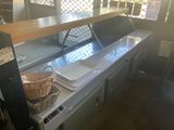 an image of a kitchen with a counter and a basket on the counter