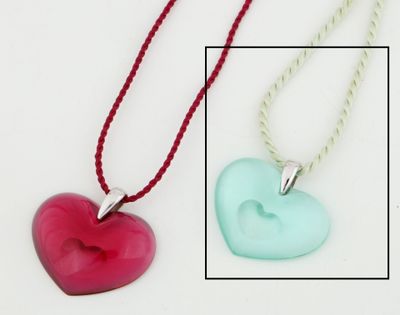 two necklaces with a heart shaped pendant on them