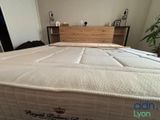 a bed that has a mattress on it in a room