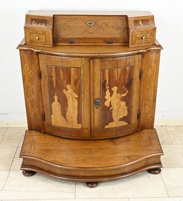 a wooden cabinet with a carved design on it