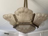 a chandelier hanging from the ceiling in a room
