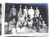 an old black and white photo of a group of men posing for a picture