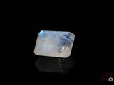 a white and blue quartz stone sitting on top of a black surface