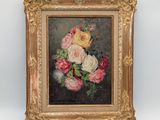 tableau représentant un bouquet de fleurs dans un cadre doré sur fond blanc