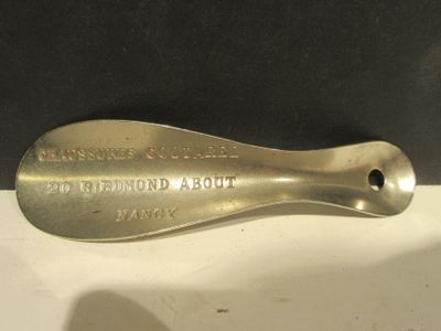 a metal spoon that is sitting on a table