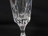 a glass that is sitting on a black table
