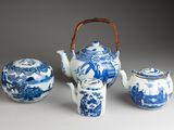 three blue and white teapots and a tea pot