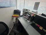 a desk with a computer and a keyboard on it