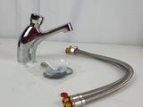a faucet with a hose attached to it on a table