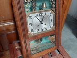 a clock that is sitting on a chair in the room