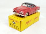 a red toy car sitting on top of a yellow box