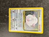 a close up of a pokemon card with a picture of a pig on it