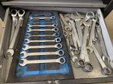 a drawer full of wrenches and other tools in it