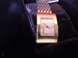 a watch that is sitting on top of a velvet case