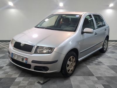 a picture of a silver car parked in a garage
