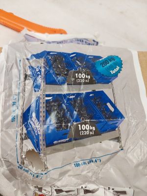 packaging of toothbrushes and toothpaste on a table with a toothbrush