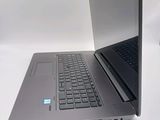 two laptops sitting side by side on a white surface