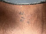 a close up of a metal object with writing on it