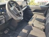 the interior of a car with a steering wheel and dashboard controls
