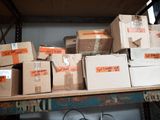 many boxes that are on a shelf in the room