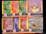 six cards with different designs on them on a black background