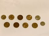 a lot of coins that are on the table