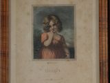 two framed prints of a young girl in a red dress