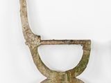 pair of wooden chairs with green paint on them against a white wall