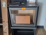 a stove with a box on top of it in a room