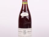 a bottle of wine that is sitting on a table