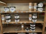 many cans of paint on the shelves in the store