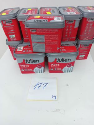 a stack of red boxes with labels on them sitting on a table