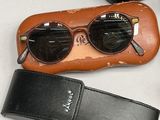 a pair of sunglasses and a case sitting on a table