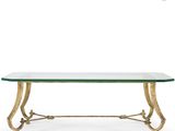 a brass and glass coffee table with a glass top