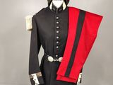 a black and red uniform on a mannequin stand