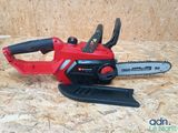 the chainsaw is sitting on a piece of wood on the floor