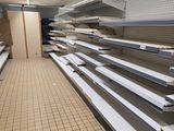 many empty shelves in a store that are empty
