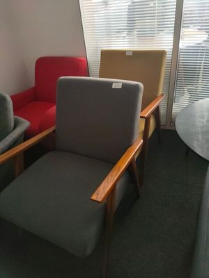 two chairs and a table in the corner of a room