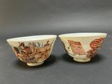 pair of chinese porcelain bowls with figures on them