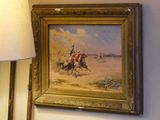 une photo d'un tableau accroché au mur à côté d'une lampe