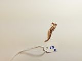 a picture of a piece of jewelry on a white surface