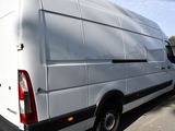 a white van that is parked on the side of the road
