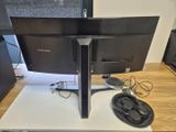 a computer monitor sitting on top of a desk