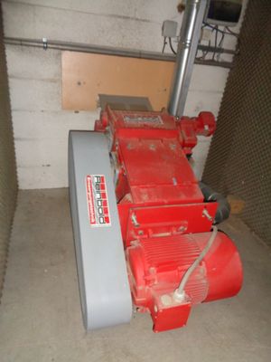 a red machine that is sitting in a room