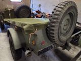 a military vehicle with a side car attached to it