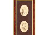 two framed portraits of two men, one in a suit and the other in a bow tie