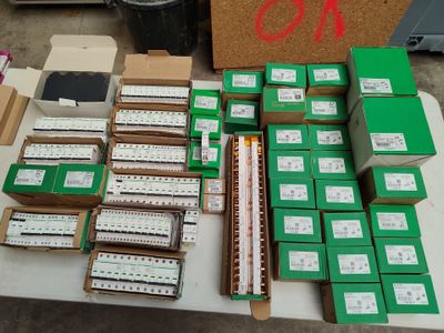 a table with many boxes of electronic equipment on it
