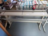 a lot of books on a table in a room