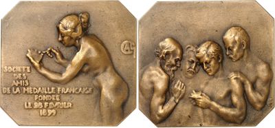 two bronze medals depicting a man and a woman with hands together