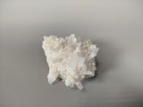 a small piece of white rock on a table